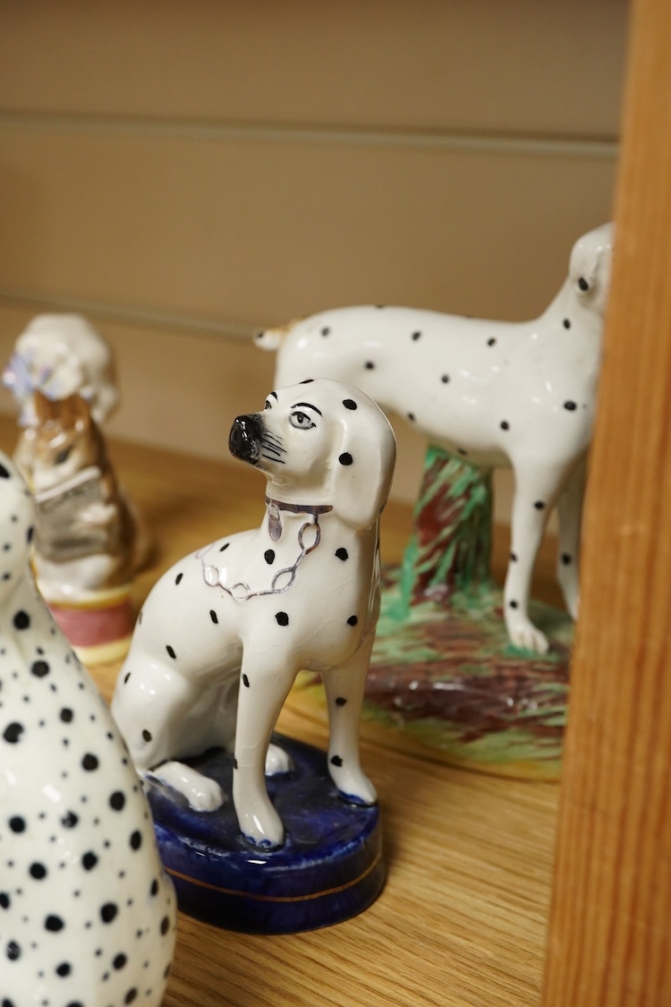 A collection of Beatrix Potter figures, three Staffordshire Dalmatians and a Copenhagen Dalmatian, tallest 16cm high